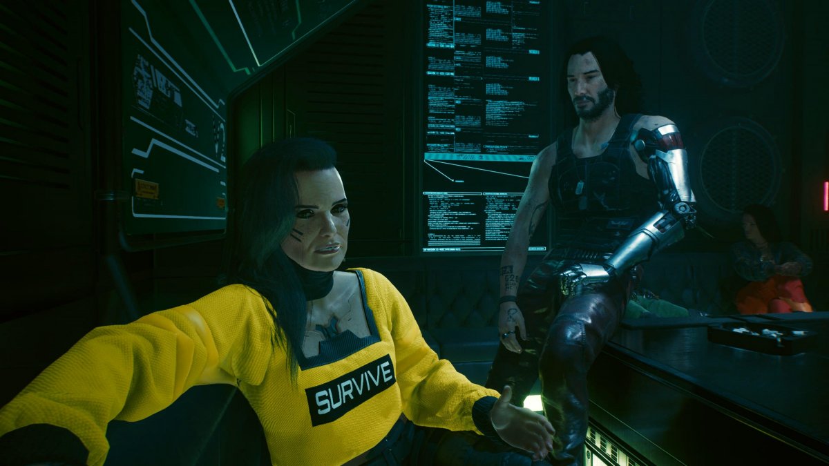 A Keanu Reeves által megformált Johnny Silverhand szinte minden fontos eseménynél jelen van, de csak a mi karakterünk látja őt •  Fotó: Cyberpunk 2077/Képernyőfotó